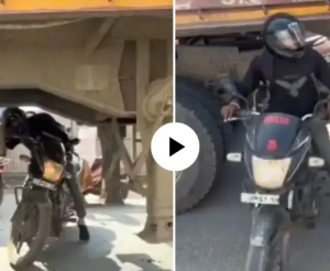 चालु ट्रकखालून बाईक बाहेर काढण्याचा तरुणाचा स्टंट; थरारक VIDEO पाहून लोक संतप्त, म्हणाले…